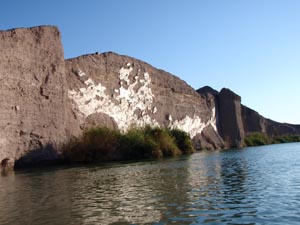 Canoeing along sheer rock cliffs.