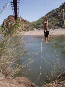 Rope swing into Verde river.