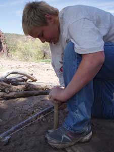 Teenager with bowdrill firestarter.