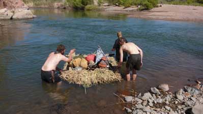 Backpacks on reed raft on Verde river.