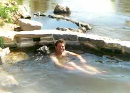 Soaking in natural hot springs.