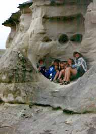 Taking shelter from storm in carved rock formation.