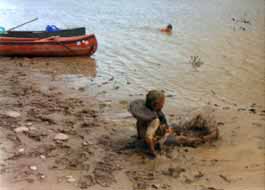 Kids playing in mud and Missouri.