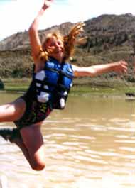 Kid jumping into the Missouri river.