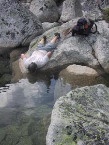 Drinking clear mountain water.