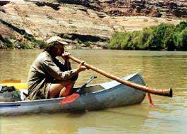 Musical horn while canoeing.