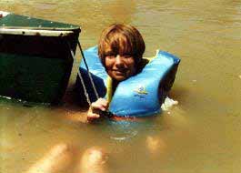 In Green River swimming along canoe.